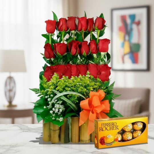 Arreglo floral Musca con rosas rojas vibrantes y chocolates Ferrero Rocher, ideal para regalar en ocasiones especiales.